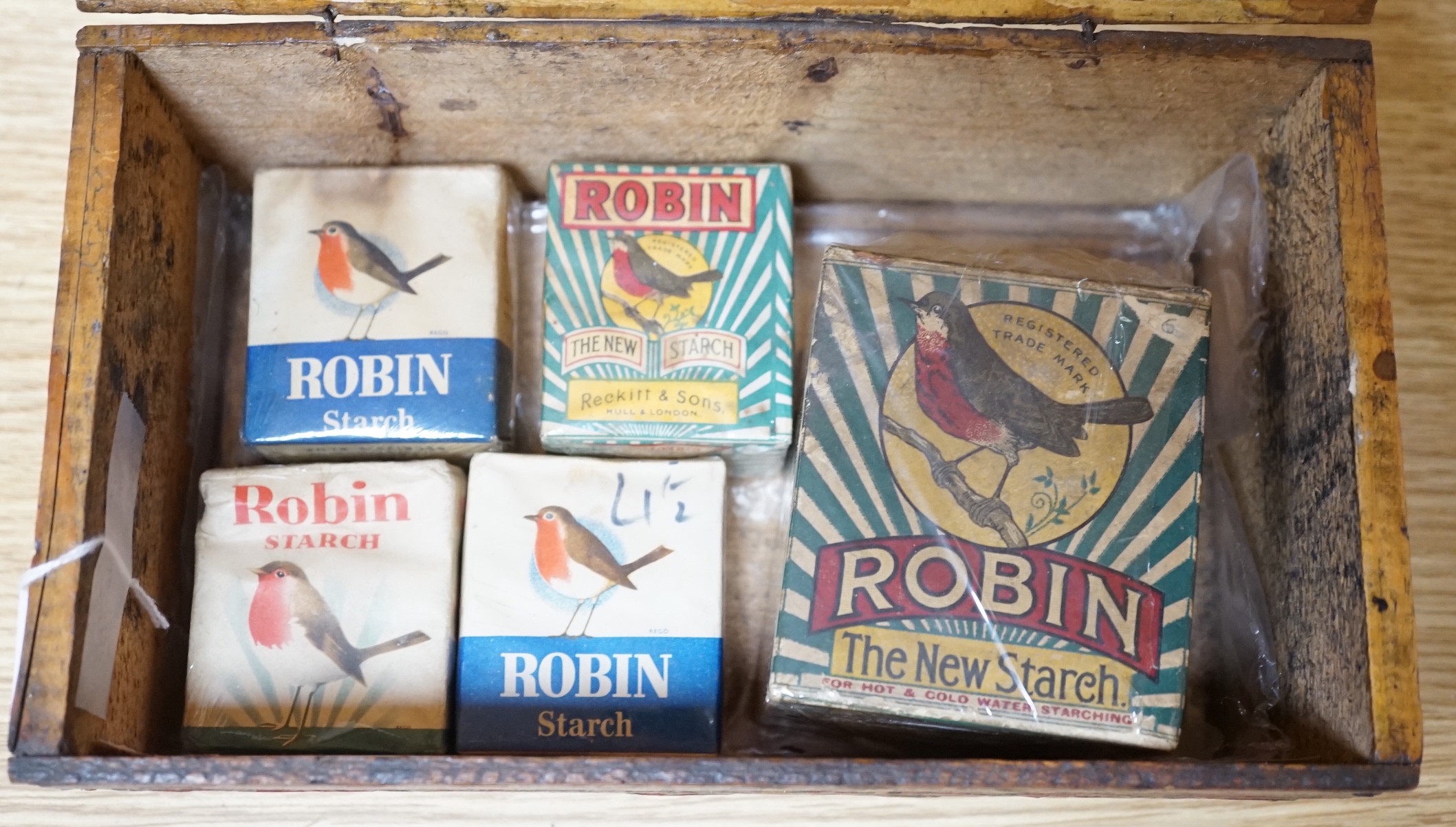 A Reckitt's Blue, Paris wooden box containing five unused packets of Robin’s Starch, box 24.5cms wide x 10cms high